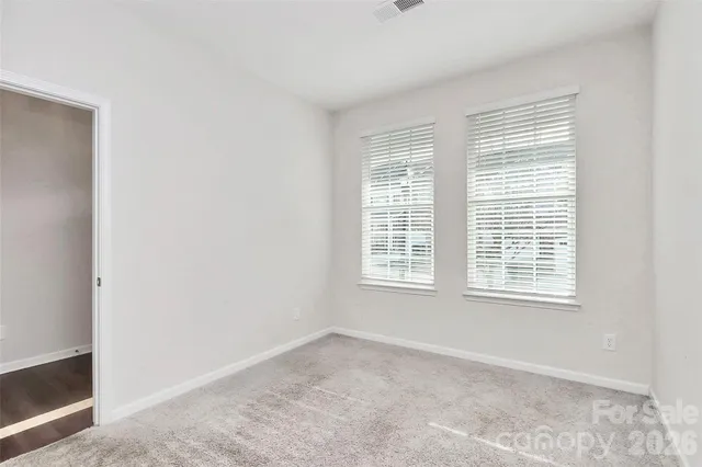 a large kitchen with stainless steel appliances granite countertop a stove a sink and a microwave