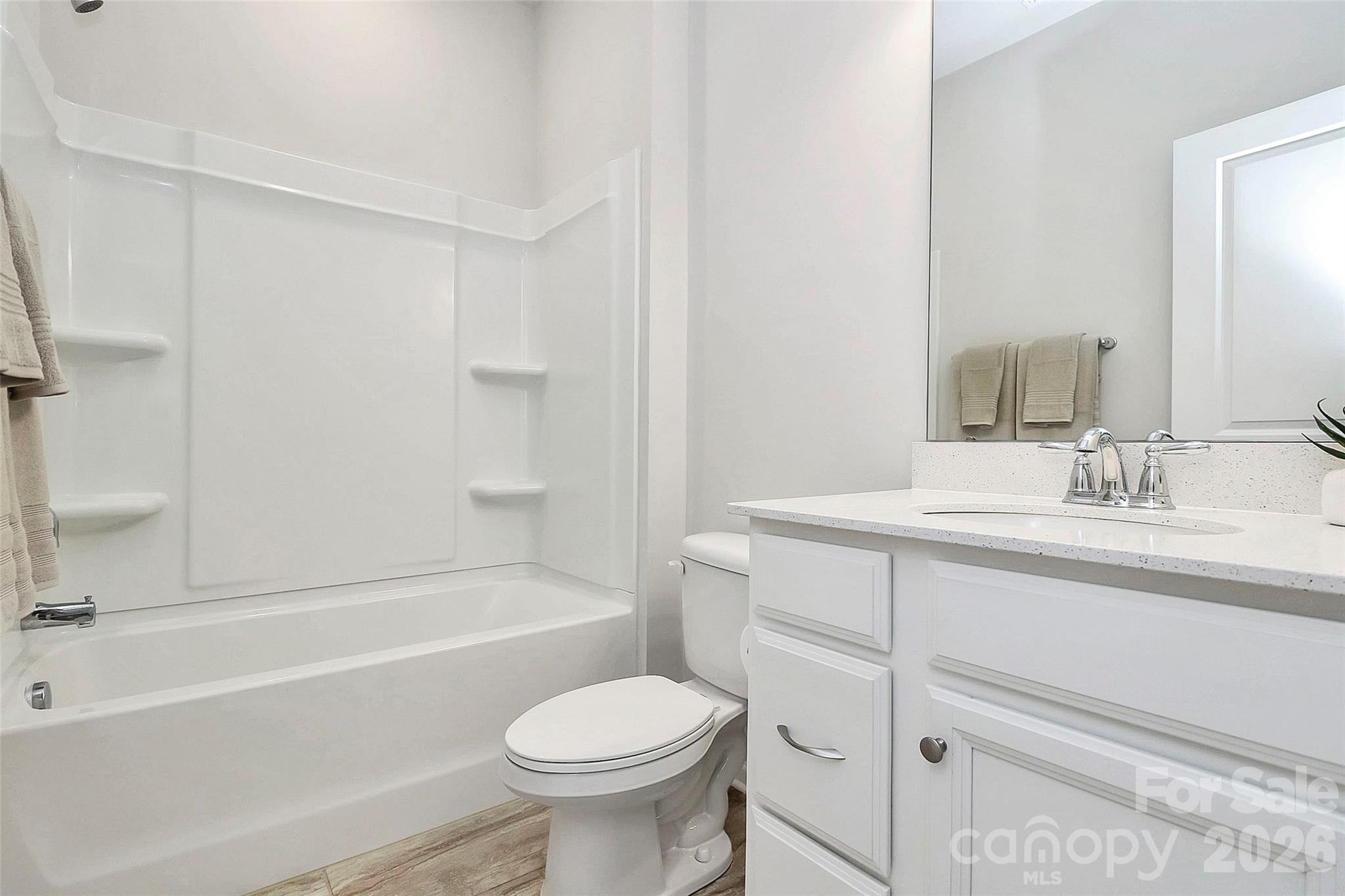 769 River Park Road Belmont, NC 28012 - Photo 7 of 41 a bathroom with a sink toilet vanity and bathtub