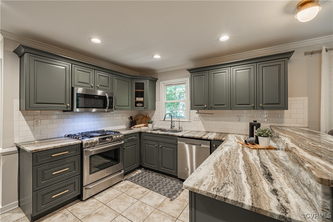 8301 Spring Meadow Road North Chesterfield, VA 23235 - Photo 17 of 50 a kitchen with stainless steel appliances granite countertop a sink and stove top oven