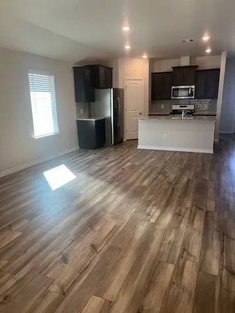a view of kitchen with furniture and window