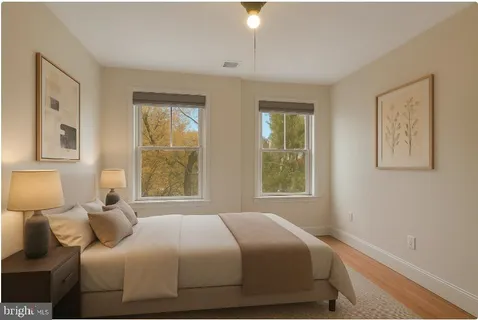 a bedroom with a bed and window