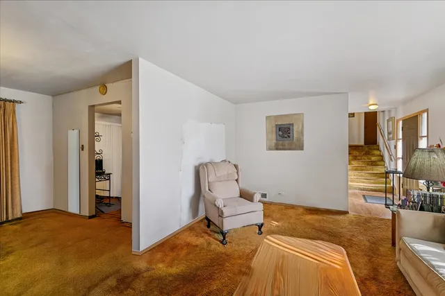 a workspace room with furniture and wooden floor
