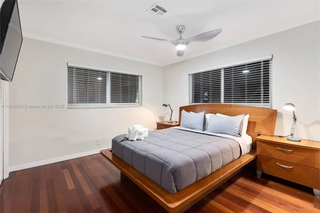 a bedroom with bed and window