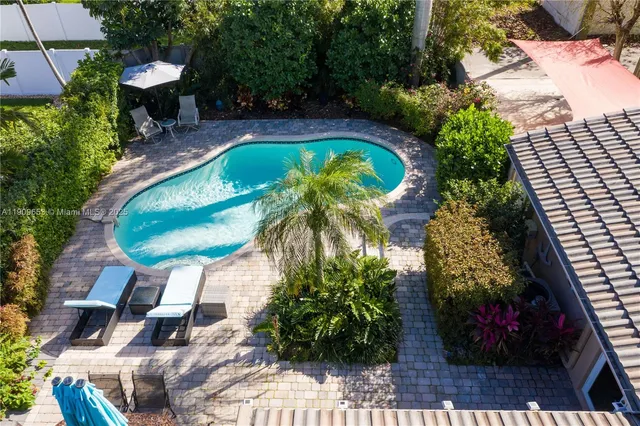 a view of a swimming pool with a patio