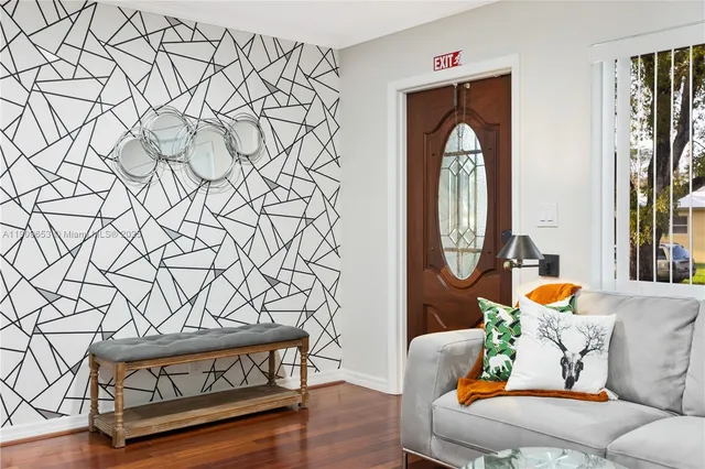 a living room with fireplace furniture and a flat screen tv