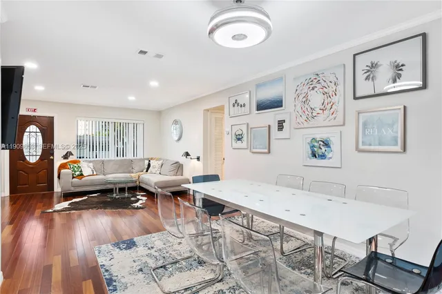 a kitchen with stainless steel appliances a stove sink microwave and cabinets