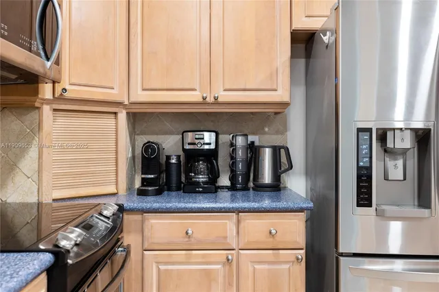 a bedroom with a large bed and a flat screen tv