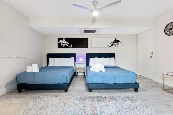 a bathroom with a sink vanity granite and shower
