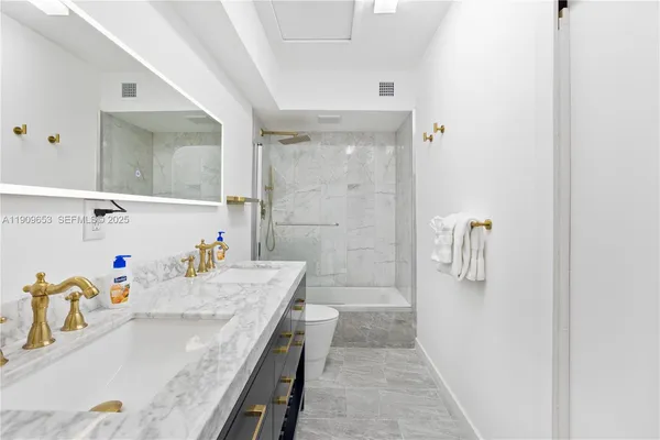 a view of a backyard with wooden fence