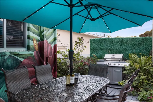 a view of a swimming pool with an outdoor space and seating area