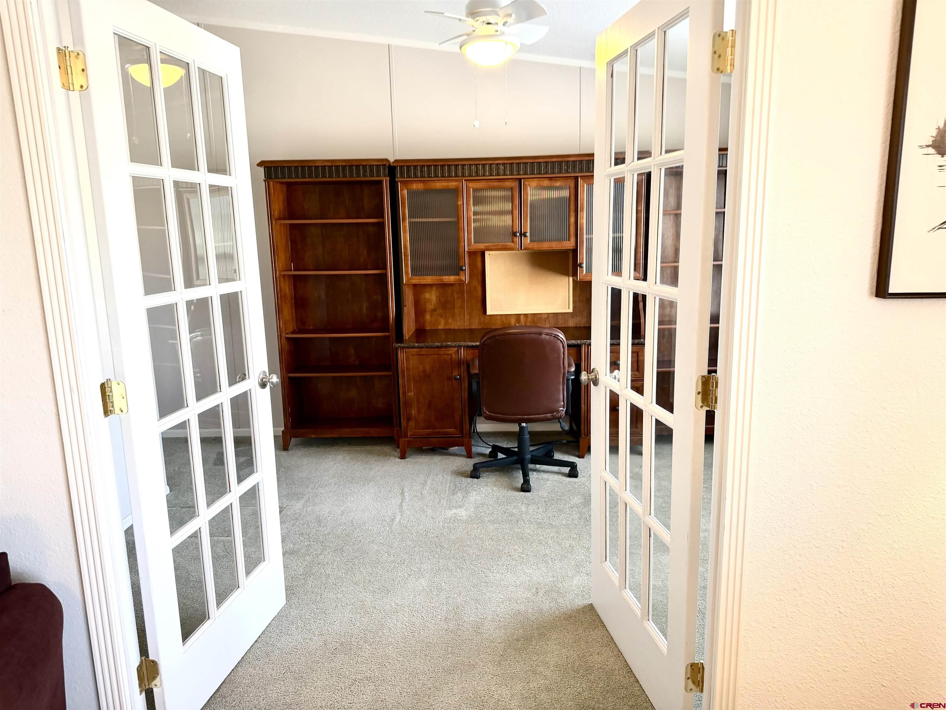 901 6530 Road, Unit 1101 Montrose, CO 81401 - Photo 15 of 45 a view of walk in closet with clothes and shoes