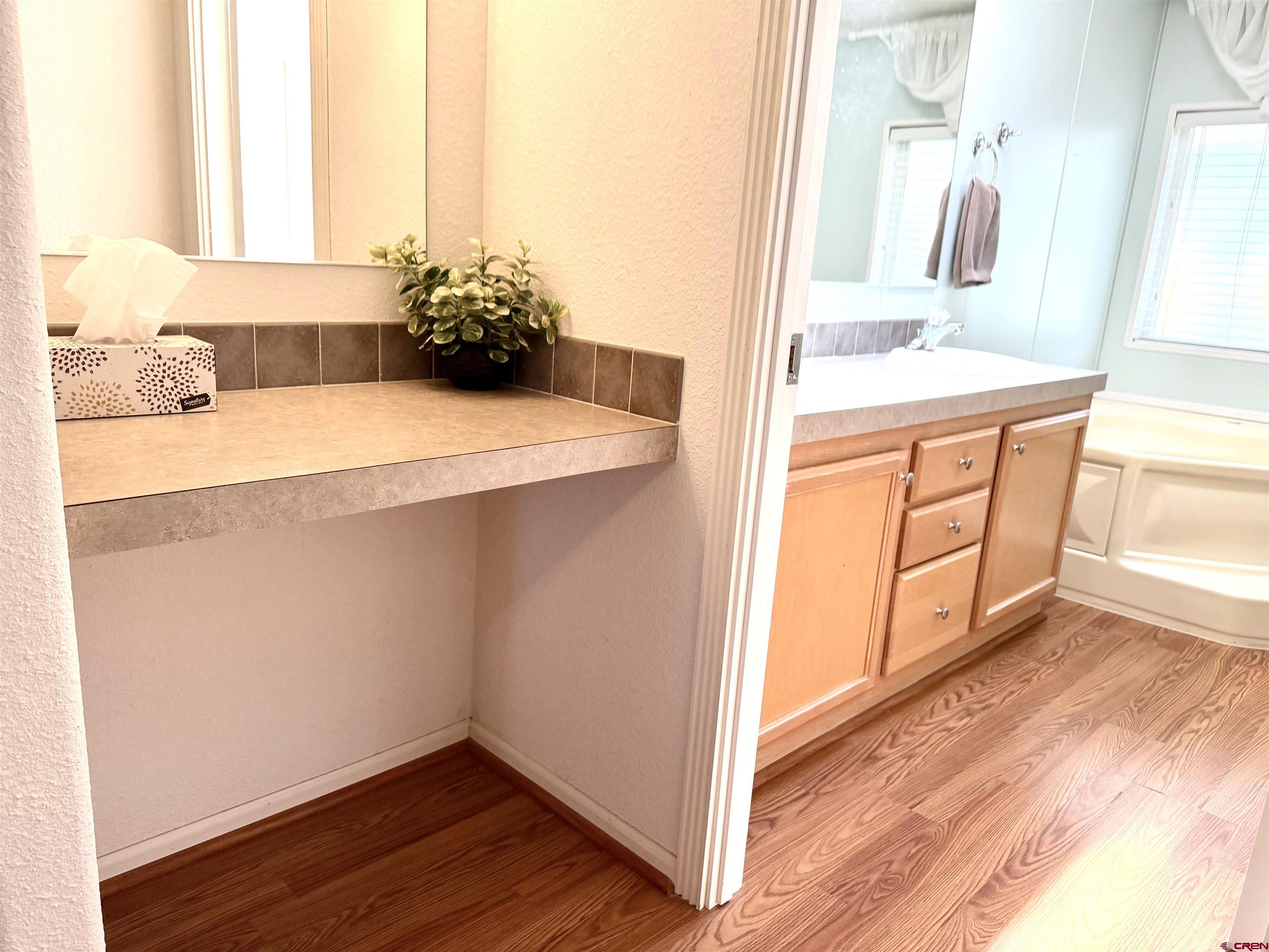 901 6530 Road, Unit 1101 Montrose, CO 81401 - Photo 19 of 45 a bathroom with a sink and a mirror