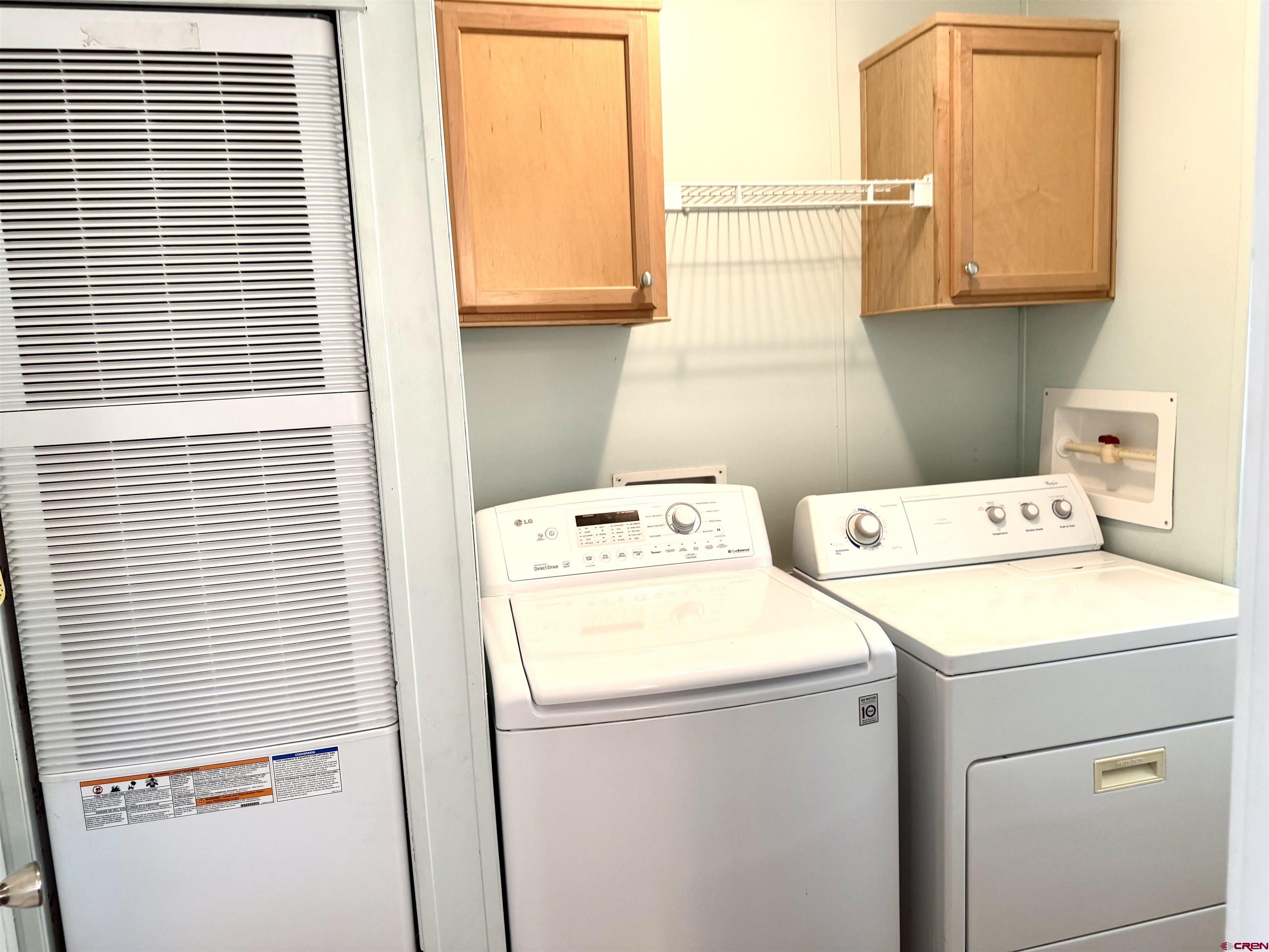 901 6530 Road, Unit 1101 Montrose, CO 81401 - Photo 23 of 45 a utility room with dryer and washer