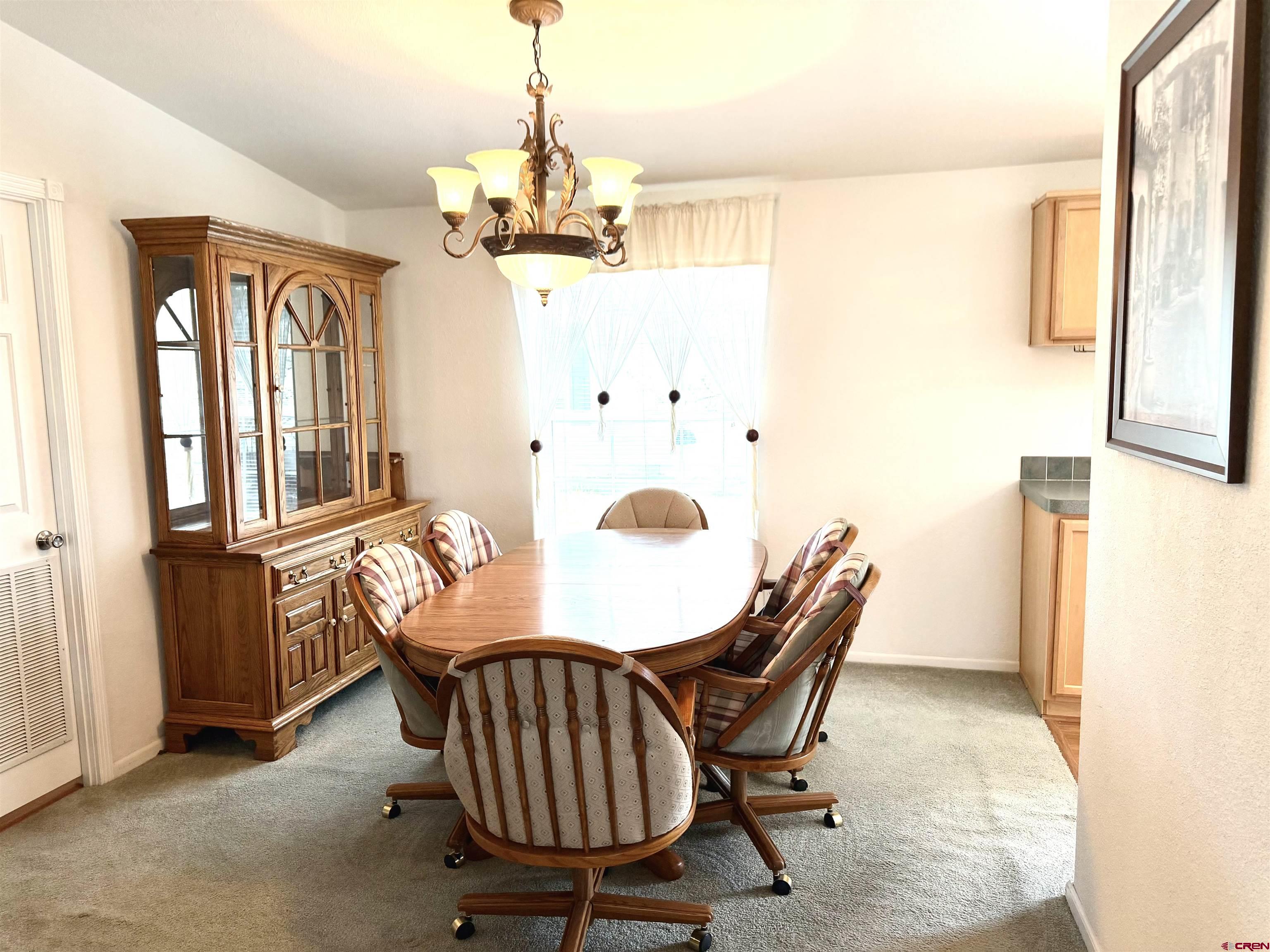 901 6530 Road, Unit 1101 Montrose, CO 81401 - Photo 24 of 45 a view of a dining room with furniture window and outside view