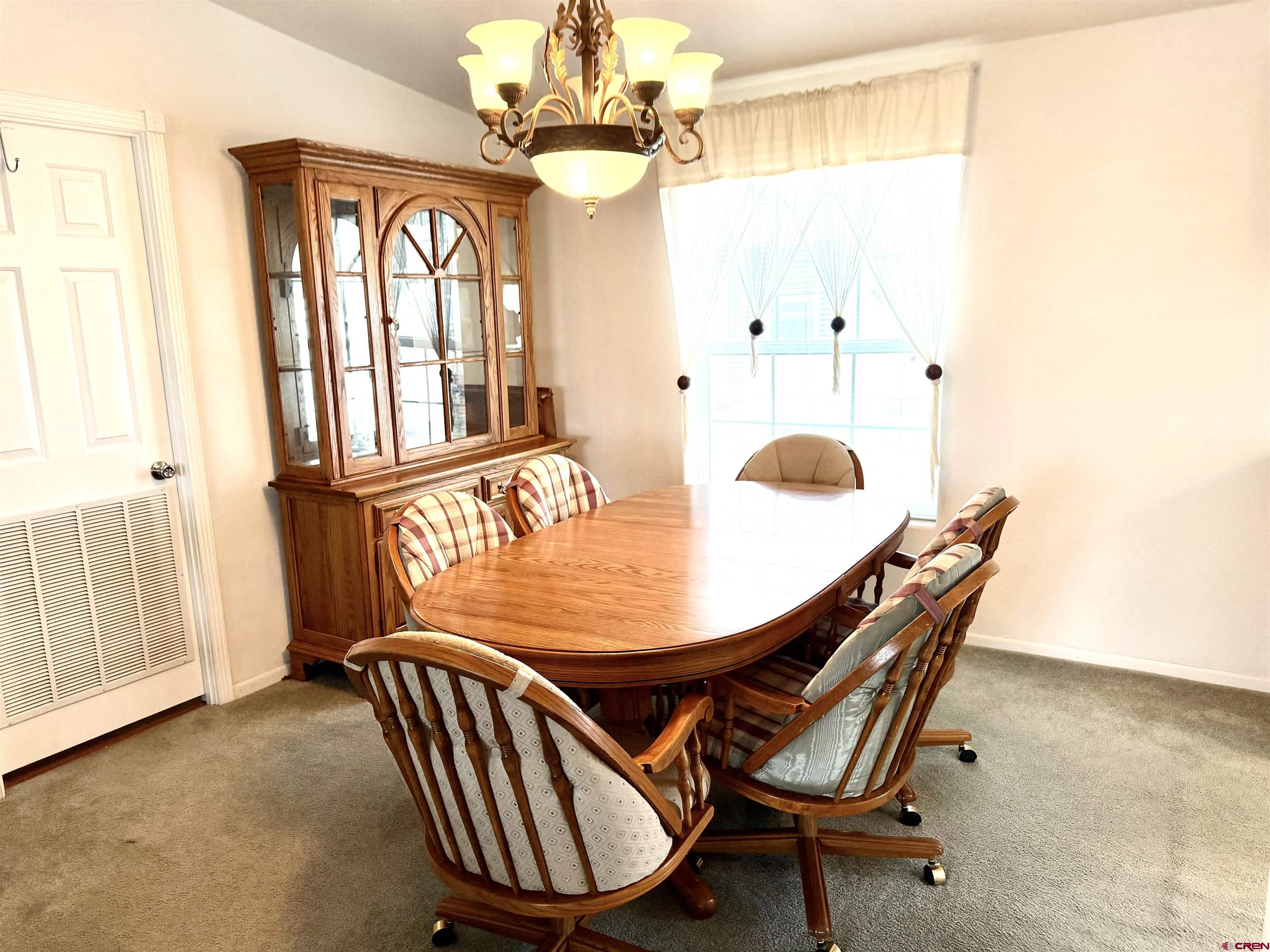 901 6530 Road, Unit 1101 Montrose, CO 81401 - Photo 25 of 45 a dining room with furniture and window