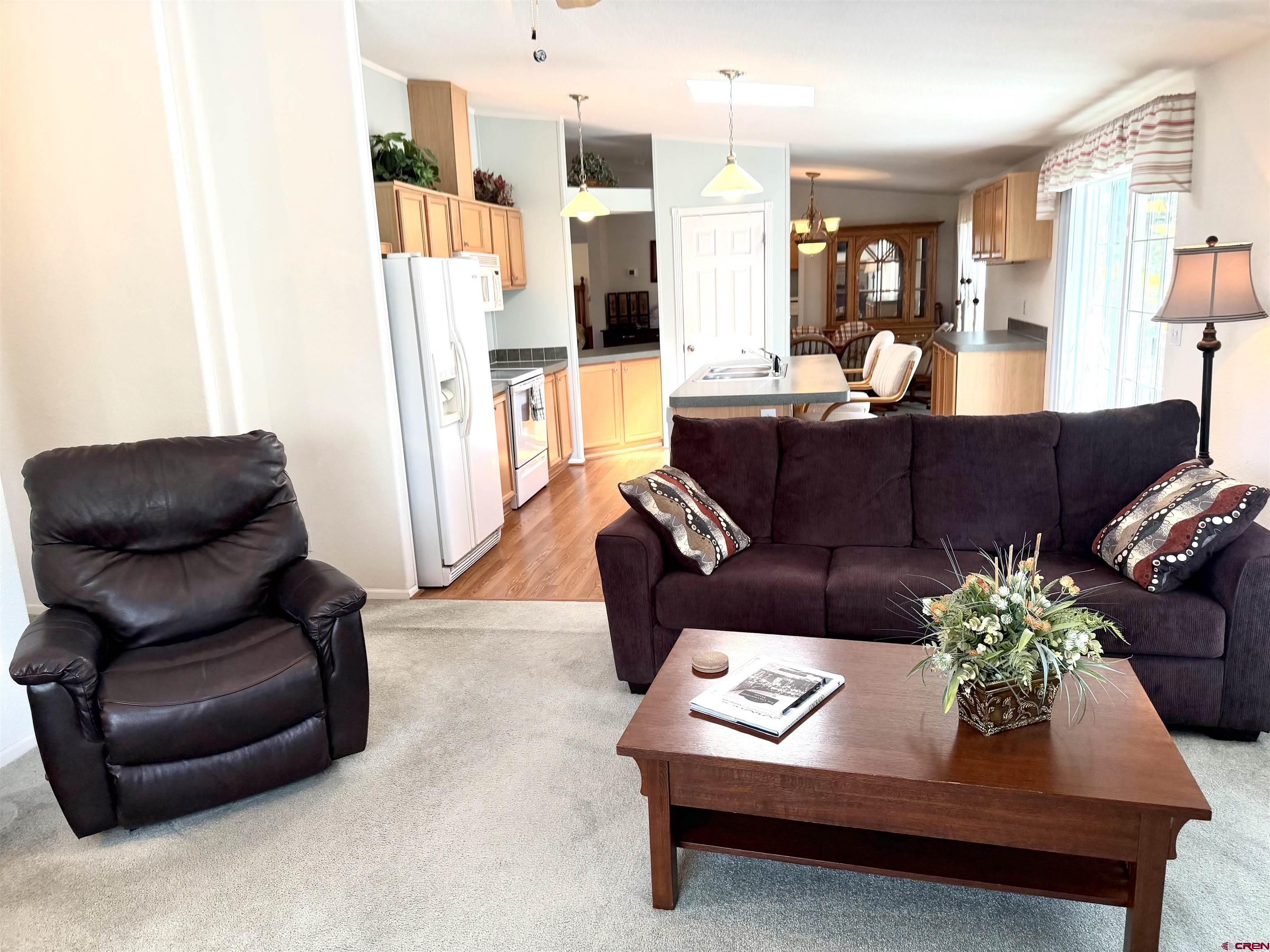 901 6530 Road, Unit 1101 Montrose, CO 81401 - Photo 37 of 45 a living room with furniture and a couch