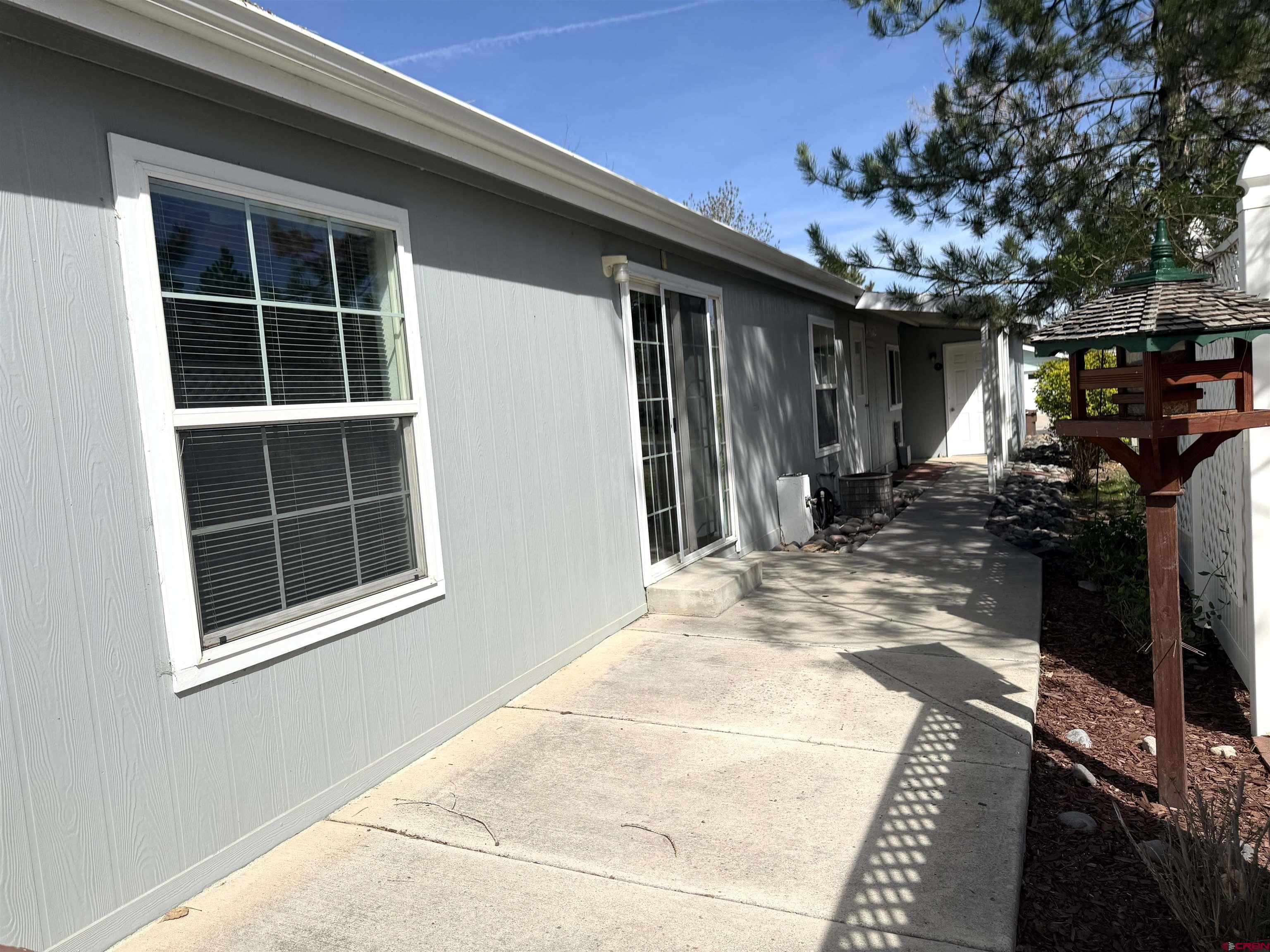 901 6530 Road, Unit 1101 Montrose, CO 81401 - Photo 10 of 45 a view of a house with a porch