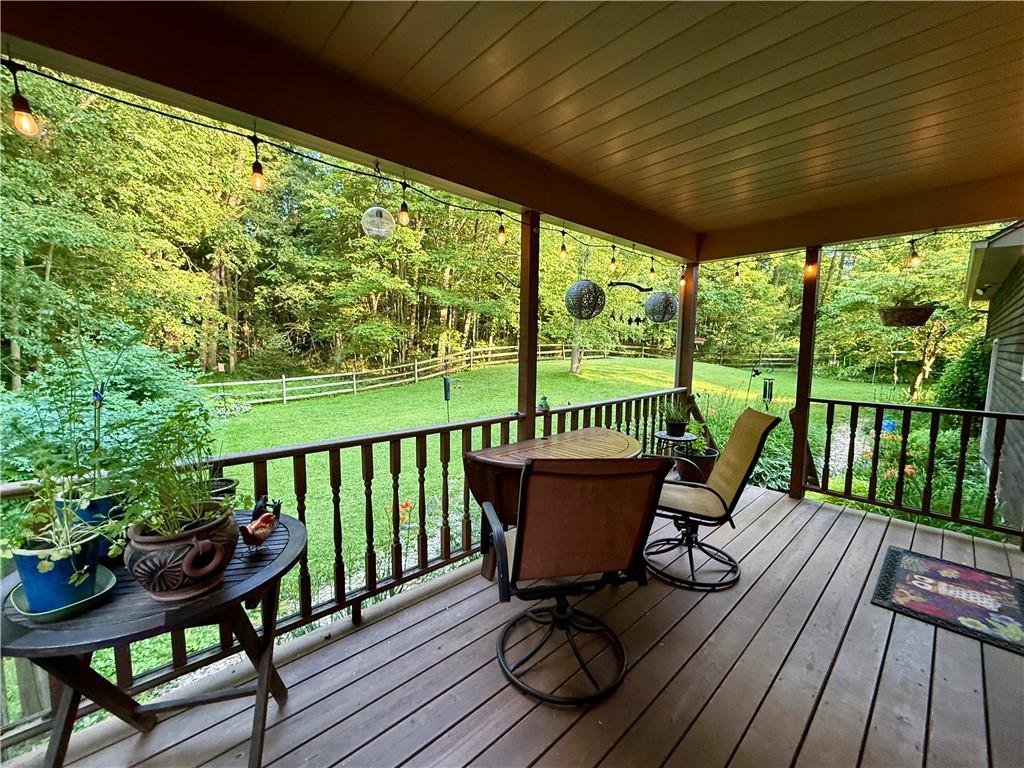 209 Modoc Trail Mercer, PA 16137 - Photo 11 of 17 a view of a chairs and table in patio with wooden floor