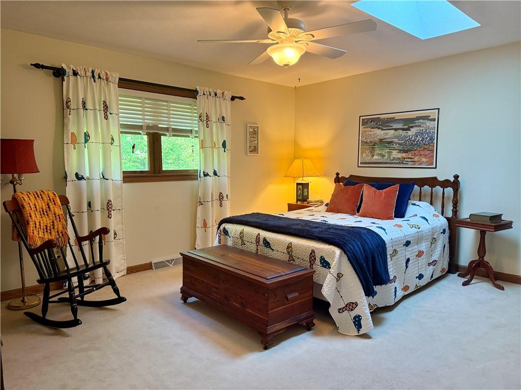 209 Modoc Trail Mercer, PA 16137 - Photo 6 of 17 a bedroom with a bed and a chandelier