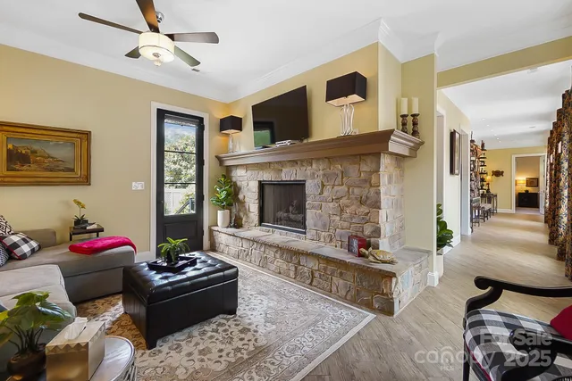 a living room with furniture fireplace and a flat screen tv