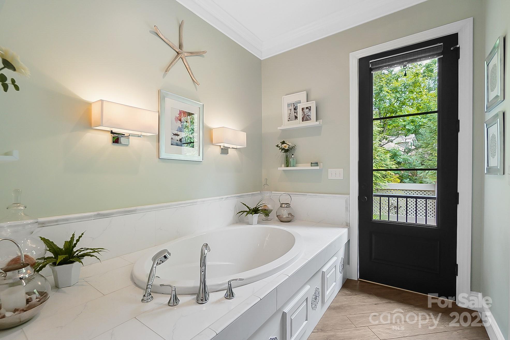 2354 Valelake Road York, SC 29745 - Photo 24 of 48 a white bath tub sitting in a bathroom next to a window