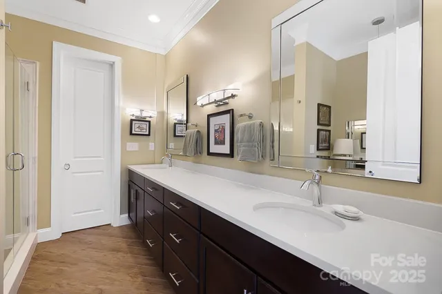 a bathroom with a double vanity sink and a mirror