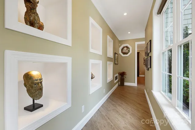 a view of a hallway view with wooden floor and staircase