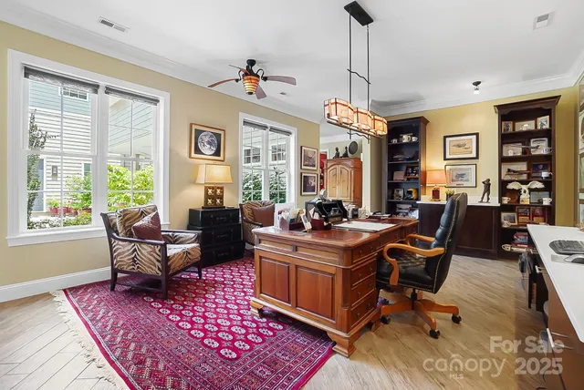 a living room with furniture a rug and a window