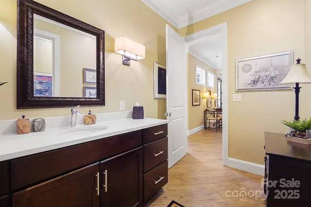 a en suite bathroom with a sink and a mirror