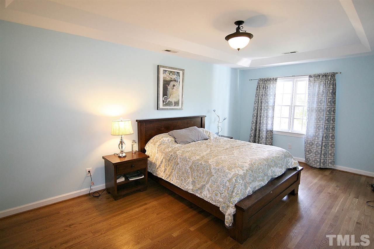 7608 Percy Court Raleigh, NC 27613 - Photo 15 of 25 Master Bedroom is just the Perfect Retreat to Relax at the End of the Day. Fine Features include a Trey Ceiling and Hardwood Floors.