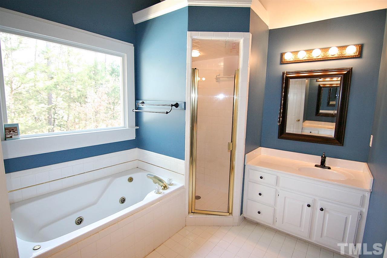 7608 Percy Court Raleigh, NC 27613 - Photo 17 of 25 Spa-like Master Bath has a Soaking Tub and Spacious Separate Shower