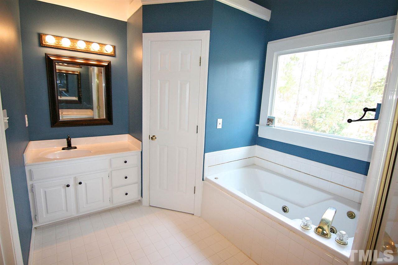 7608 Percy Court Raleigh, NC 27613 - Photo 18 of 25 Champagne Master Bath -- Has Separate His and Her Vanities plus Vaulted Ceiling
