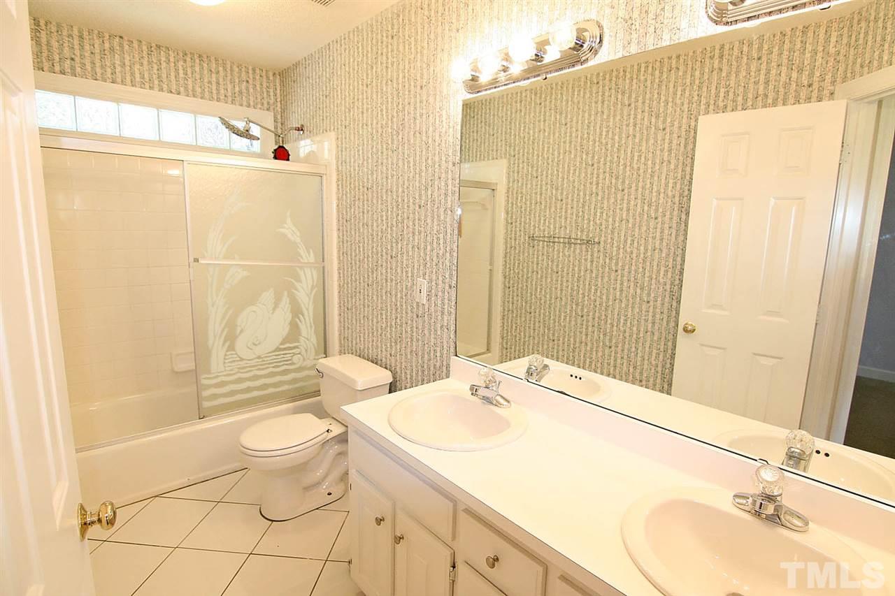 7608 Percy Court Raleigh, NC 27613 - Photo 20 of 25 Oversized Hall Bathroom has a Mirrored Double Vanity