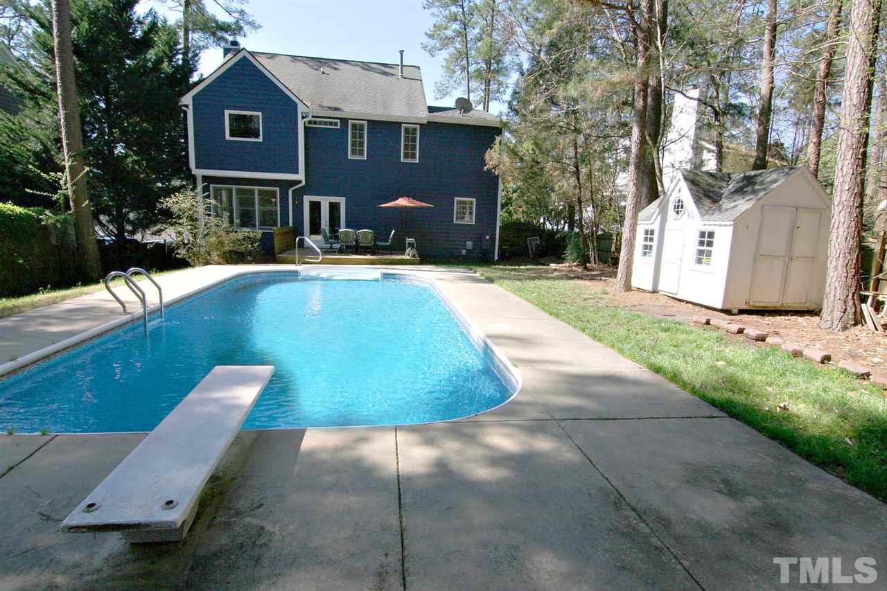 7608 Percy Court Raleigh, NC 27613 - Photo 24 of 25 Amazing Backyard is Nestled under Mature Trees for a Tranquil Setting. Pool Cottage will hold all your Backyard Accessories.