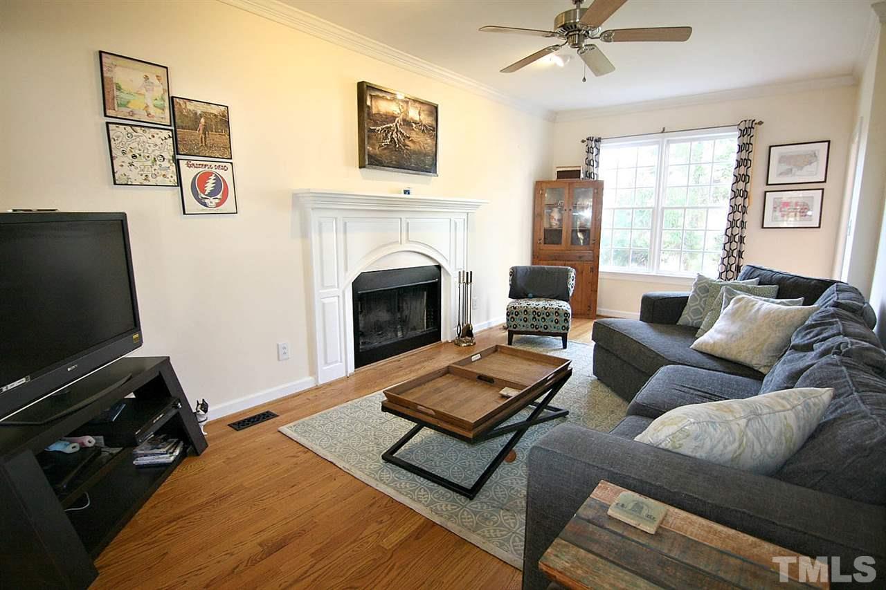7608 Percy Court Raleigh, NC 27613 - Photo 5 of 25 Charming Great Room is Bright and Spacious ... Has Wood-burning Fireplace, 9' Smooth Ceilings, Hardwood Floors and Crown Molding