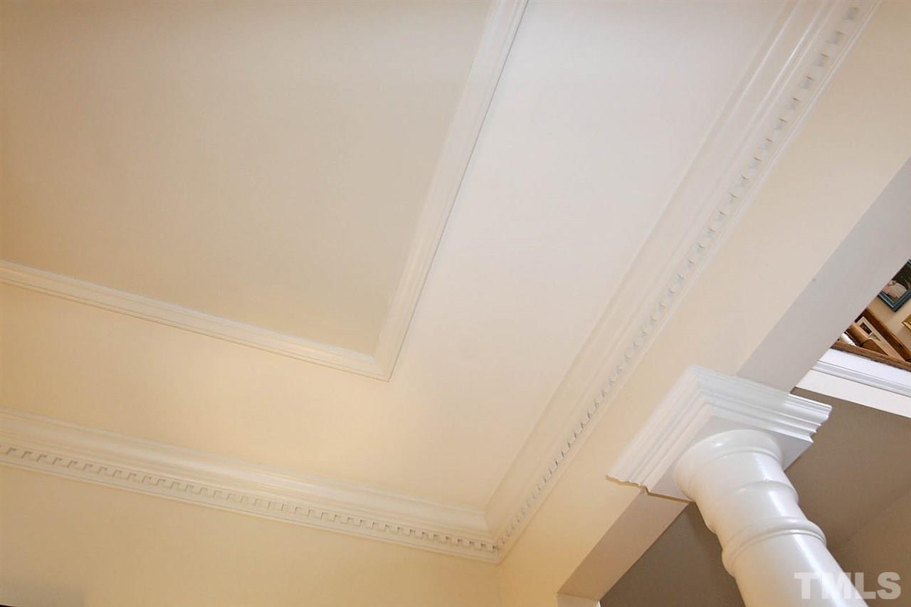 7608 Percy Court Raleigh, NC 27613 - Photo 9 of 25 Savour the Essence of the Architectural Details in the Dining Room -- Dentil Molding and Window Pane Ceiling Trim + Columns -- Making the Dining Space a Joy for Dinner Parties