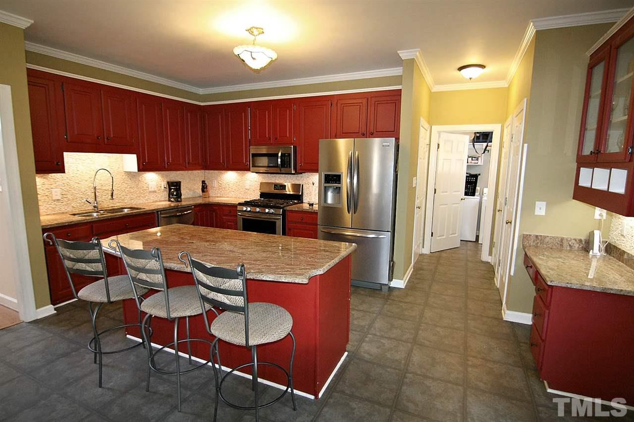 7608 Percy Court Raleigh, NC 27613 - Photo 10 of 25 A REAL Chef's Kitchen has a Center Island and Eat-at Bar
