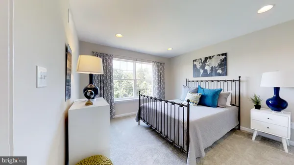 a bed room with a bed and a window