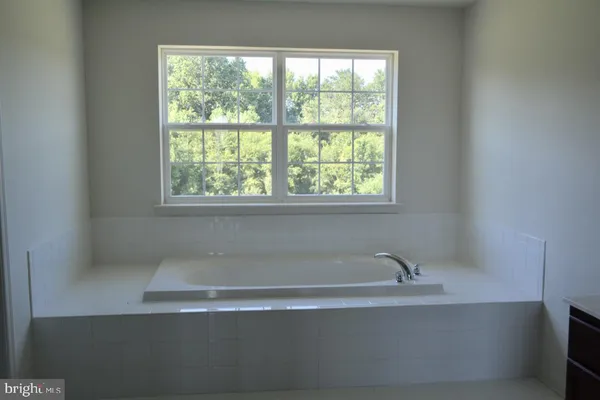a bathroom with a sink toilet and tub
