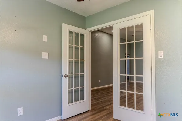 a view of empty room with windows