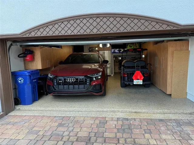 a view of a car parked in front of a house