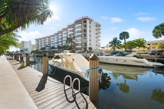 a view of a swimming pool with outdoor seating space