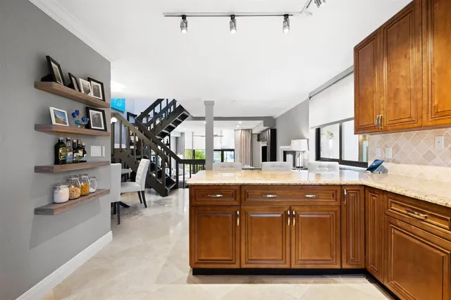 a kitchen with a sink and cabinets