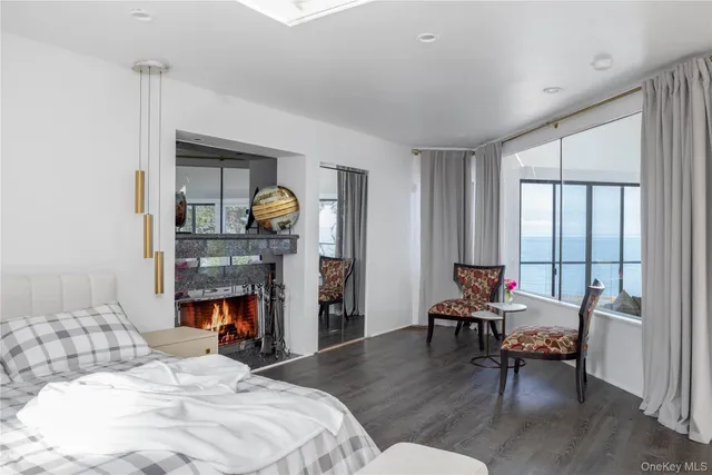 a bedroom with furniture and a fireplace