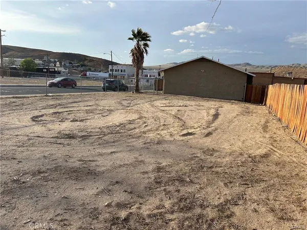 a view of a house with a snow in the yard
