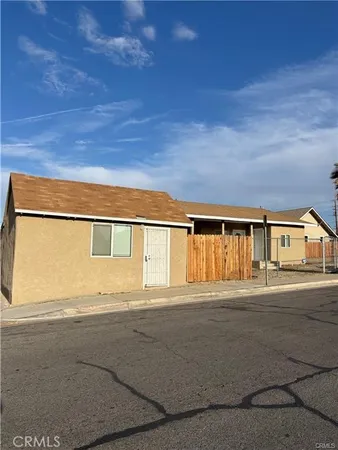 a front view of a house with a road and a road