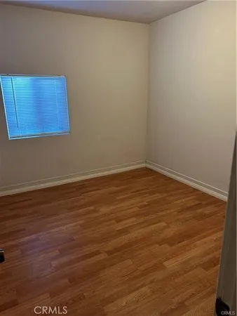 a view of room with wooden floor