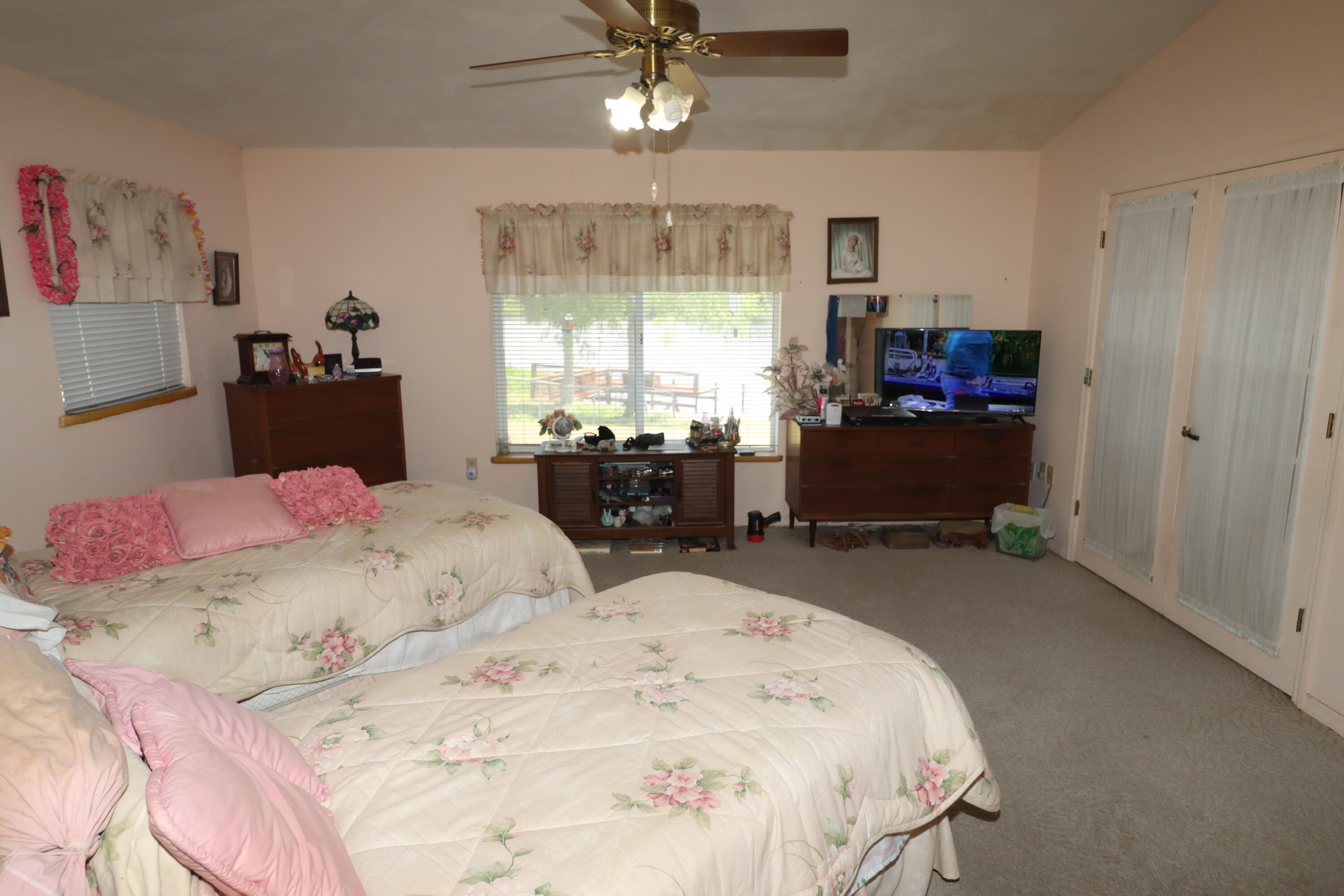 13578 Southwest 144th Parkway Okeechobee, FL 34974 - Photo 14 of 21 a bedroom with a bed and a window