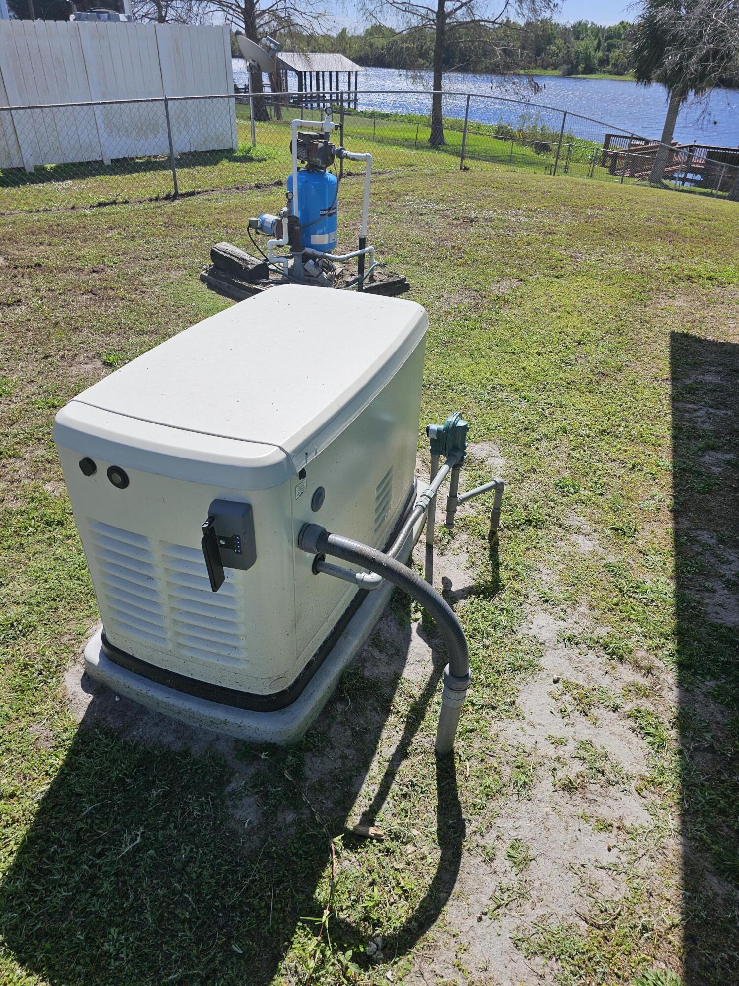13578 Southwest 144th Parkway Okeechobee, FL 34974 - Photo 19 of 21 a view of a backyard with table and chairs