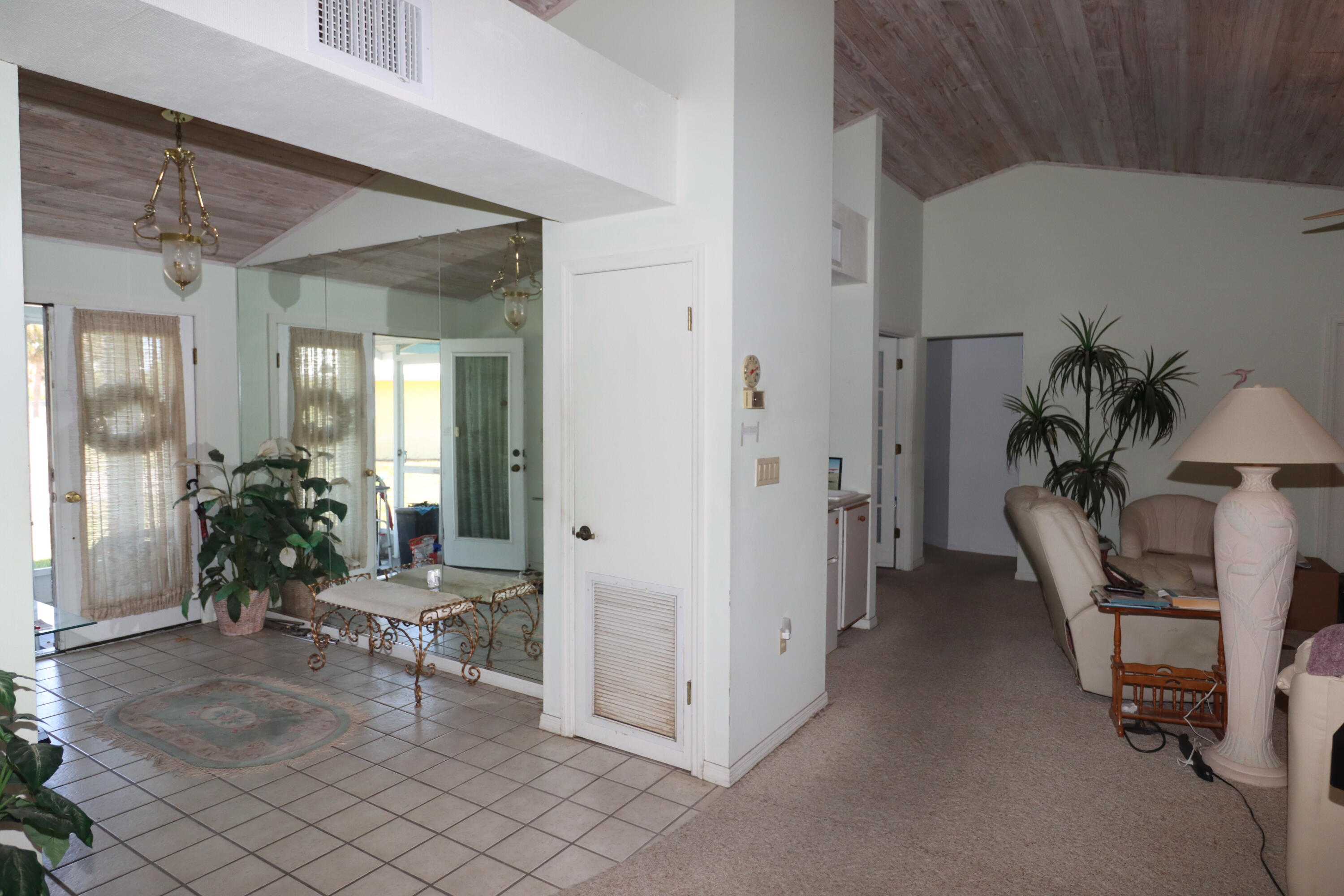 13578 Southwest 144th Parkway Okeechobee, FL 34974 - Photo 8 of 21 a view of a livingroom with furniture and a fan